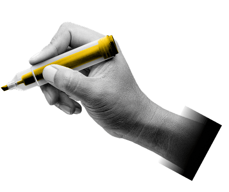 A hand writing with a highlighter